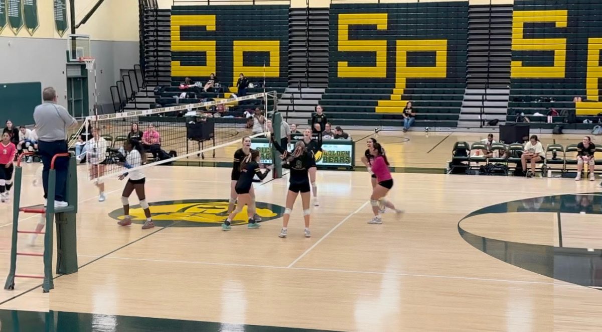 The Sierra Pacific volleyball team celebrates after scoring a point against Hanford West on Oct. 7. The Golden Bears went on to win the match 3-2.